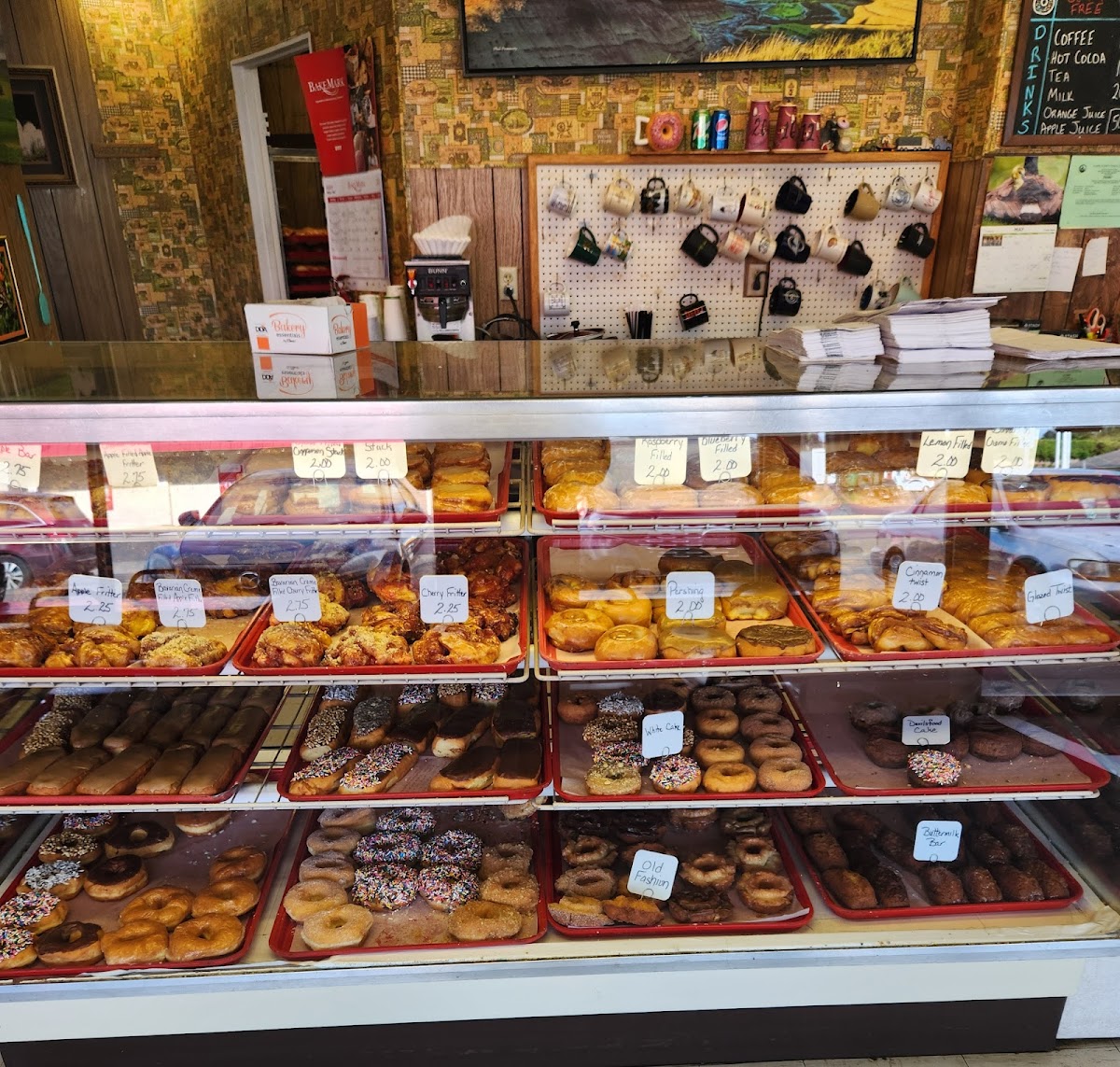 The Donut Nook display case packed with fresh donuts